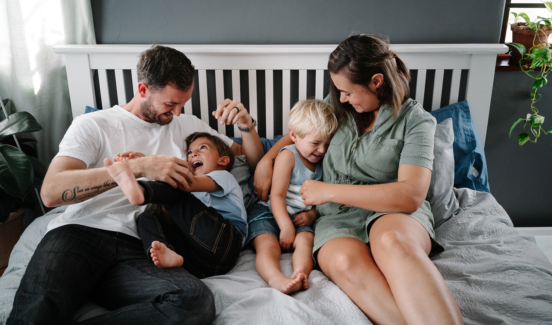 lifestyle image of a family in a modern bedroom